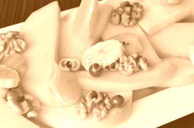 Salad of fruit with mango,walnuts,oranges,kiwi,bananas,apples