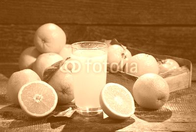 glass of orange juice with fresh fruits
