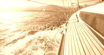 Yacht sailing towards the sunset. Sailing. Luxury yachts.