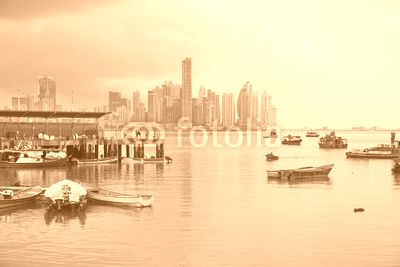 Panama city fishing harbor wharf and boats with skyscrapers buildings in background, Pacific coast of Panama, Central America