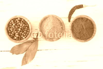 Spices and herbs on wooden background