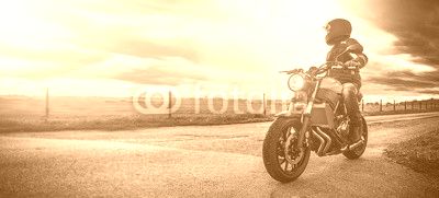 motorbike on the road riding. having fun riding the empty road on a motorcycle tour / journey