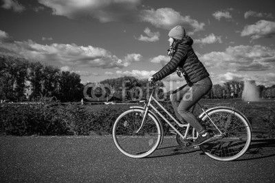 Girl biking in city 