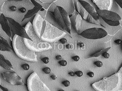 Fruit background design of citrus slices and cranberries. Fruit pattern.