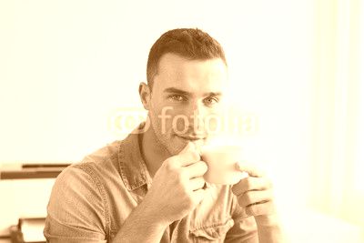 Man in the office with coffee cup