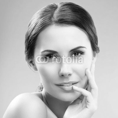 portrait of woman with naked shoulders, on blue