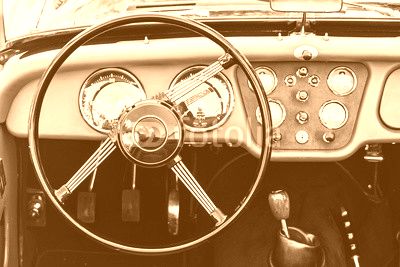 Steering wheel and dashboard in historic vintage car