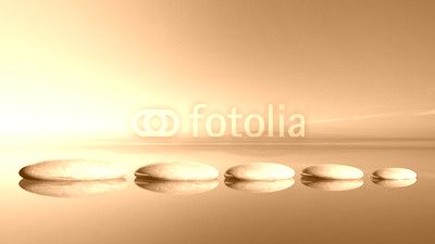 Zen stones row from large to small  in water with blue sky and peaceful landscape background.