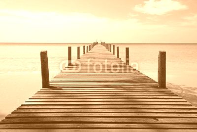wooden jetty on sunny beach