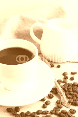 coffee in a white cup on a wooden background