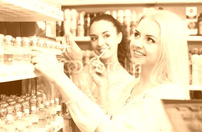 Female friends buying perfume