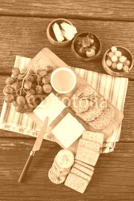 Gouda cheese, brown bread slices, lime juice biscuits and fruits