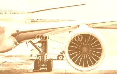 Detail of airplane engine wing at terminal gate before takeoff - Wanderlust travel concept around the world with air plane at international airport - Retro contrast filter with light blue color tones