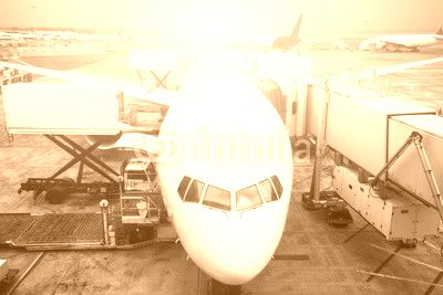 airport with crowded airplanes with sunbeam