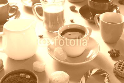 cup of coffee, tea and cacao at purple background