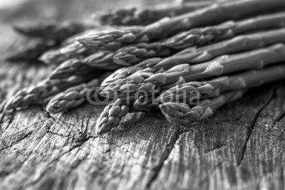 Fresh organic asparagus on rustic background