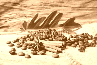 Roasted coffee beans  on sackcloth with grunge wooden  backgroun