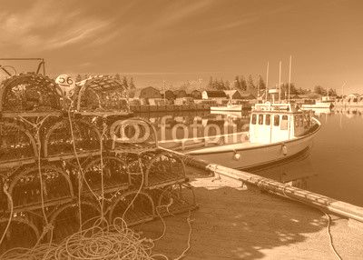 Commercial fishing boats at a wharf in rural Prince Edward Island, Canada.