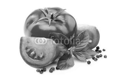 Tomatoes, basil leaves and black pepper on white.