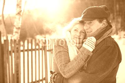 Beautiful senior couple on a walk on sunny winter day